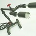 Desk lamp. Beer bottles. Plumbing pipe & fittings. Table lamp.