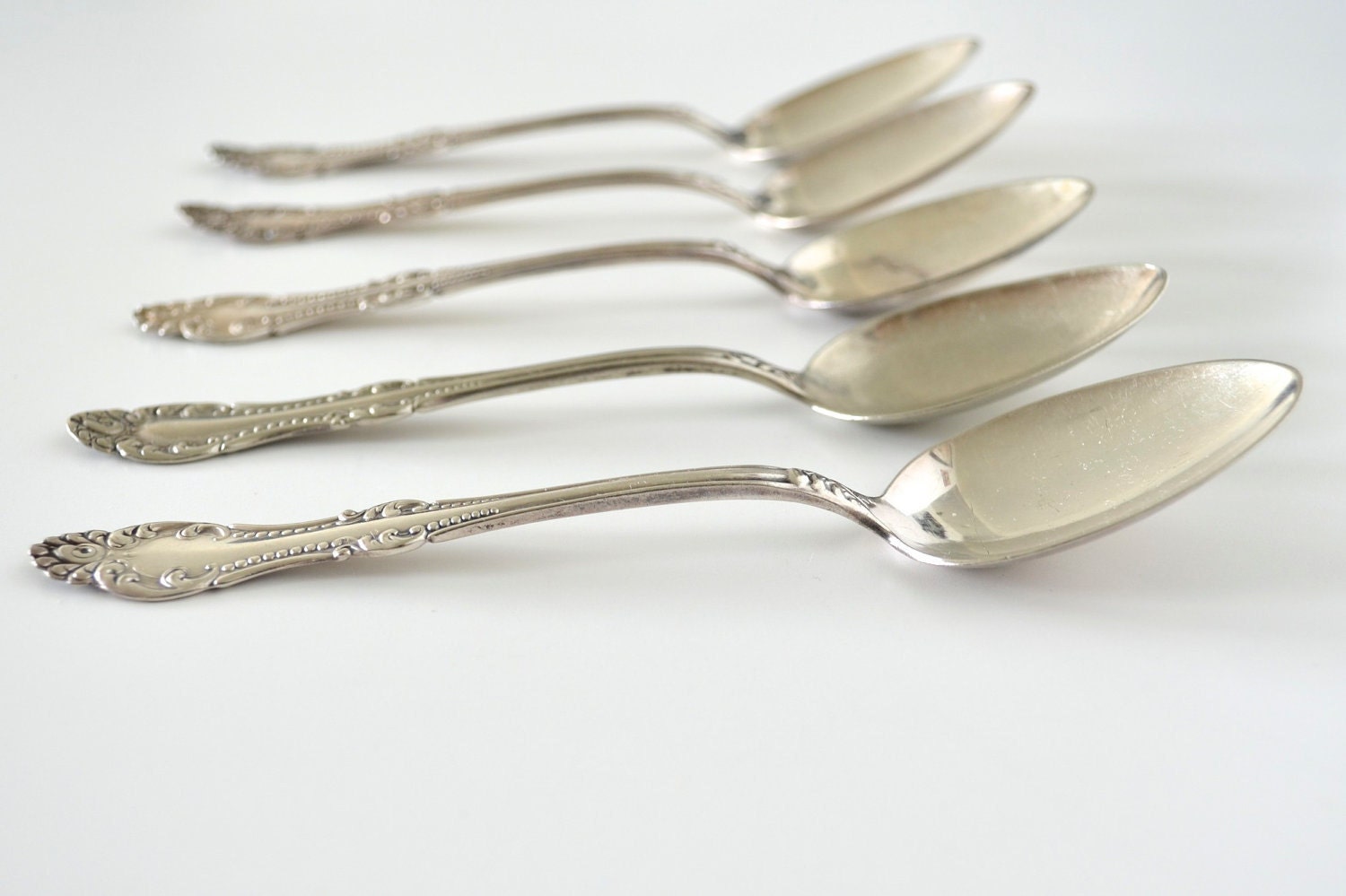 WM Rogers silver plate spoons - set of 5