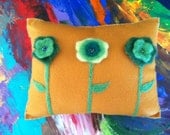 Golden mustard needle felted pillow with beaded green flowers