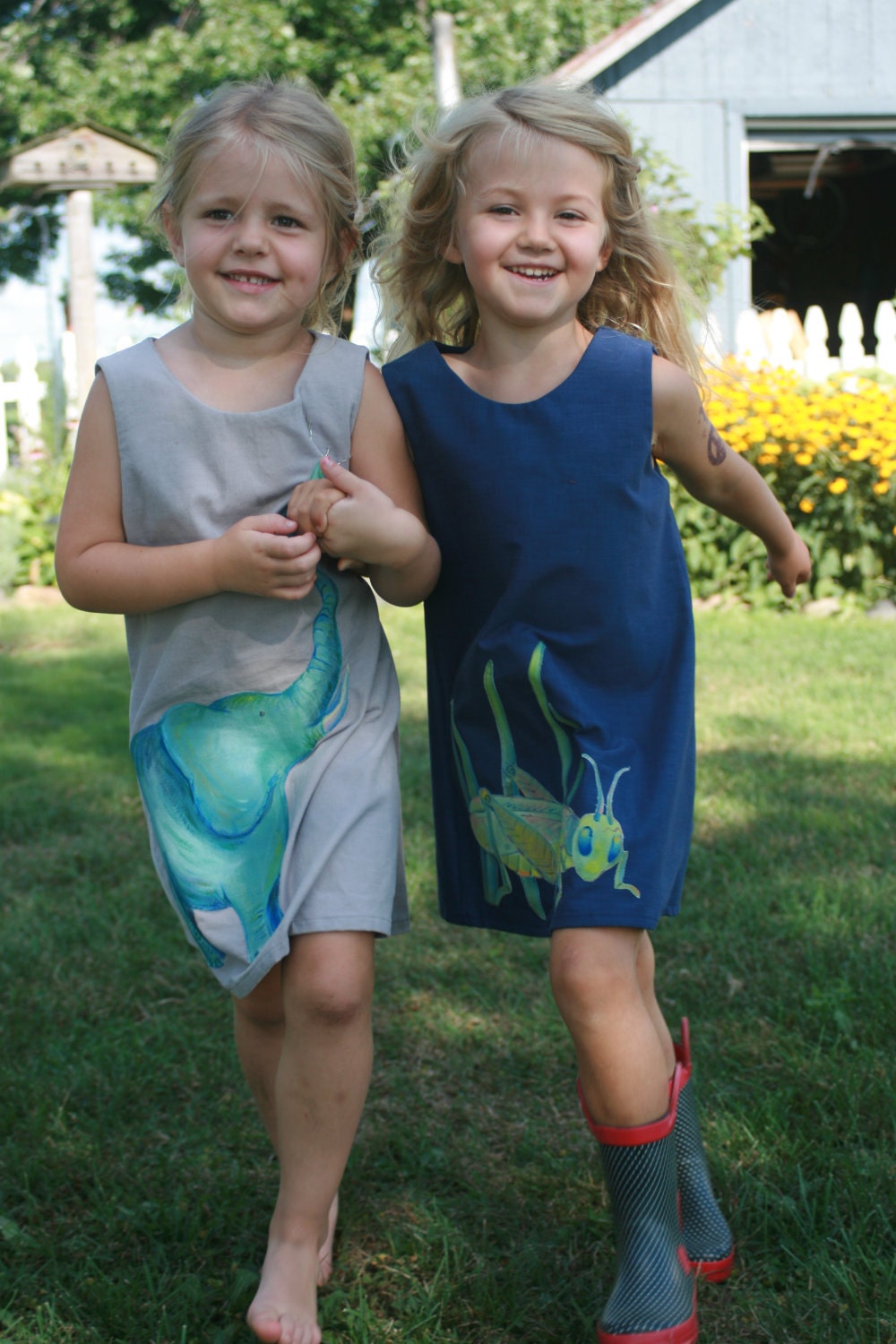 What is it you hear at your feet... Do you hear the grasshopper...  Little ladies jumper with hand painted grasshopper