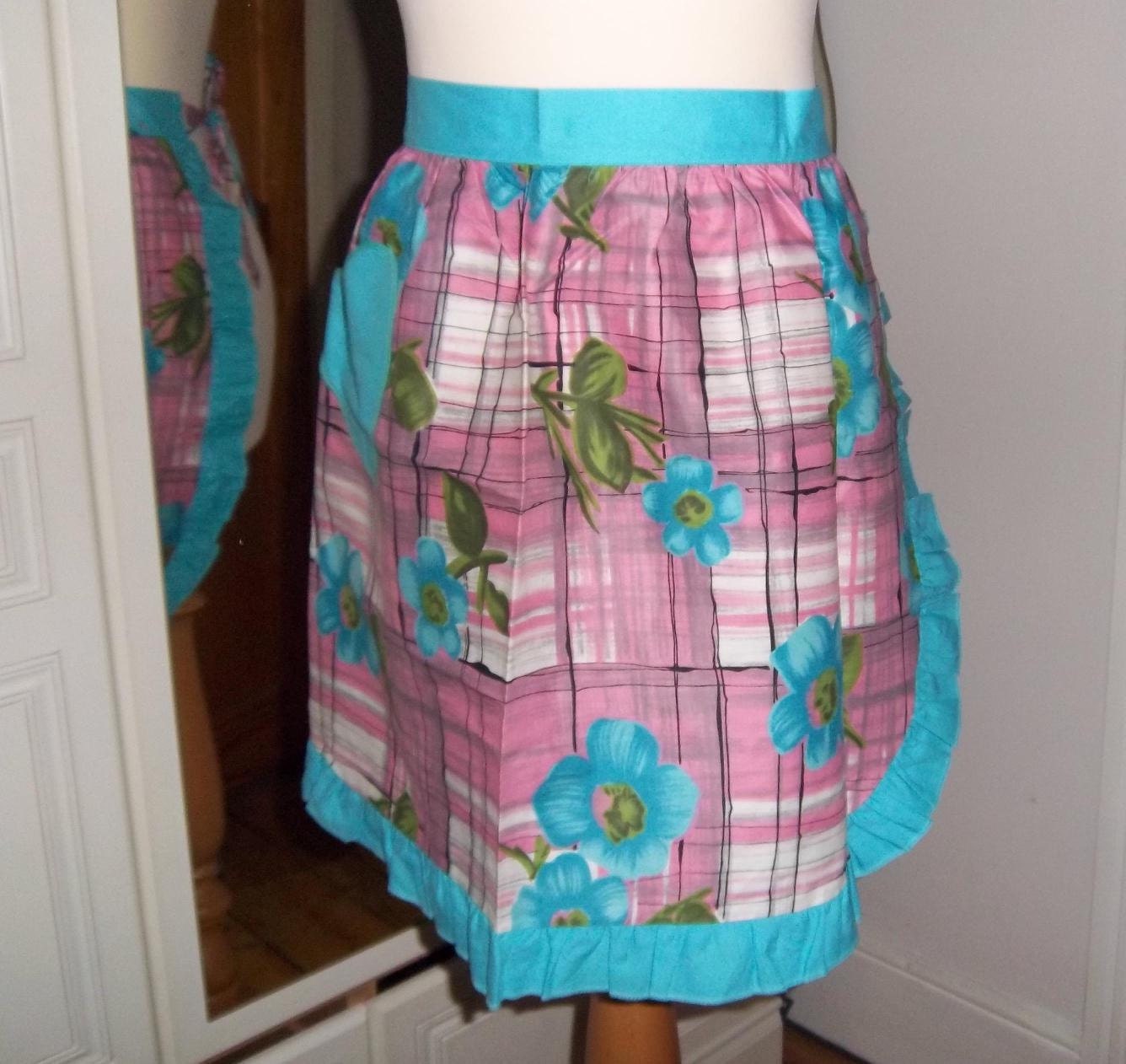 1960s turquoise pink floral half apron, heart shaped pocket.