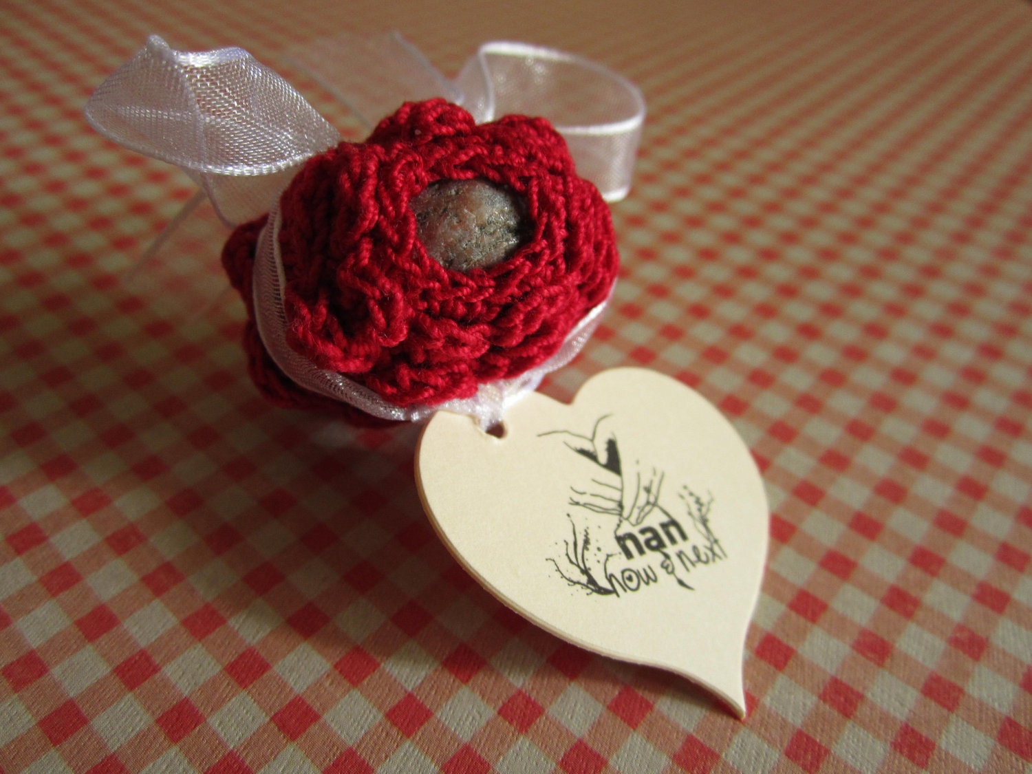 Red Tulip Stone: Hand crochet lace stone of Little Sand Bay