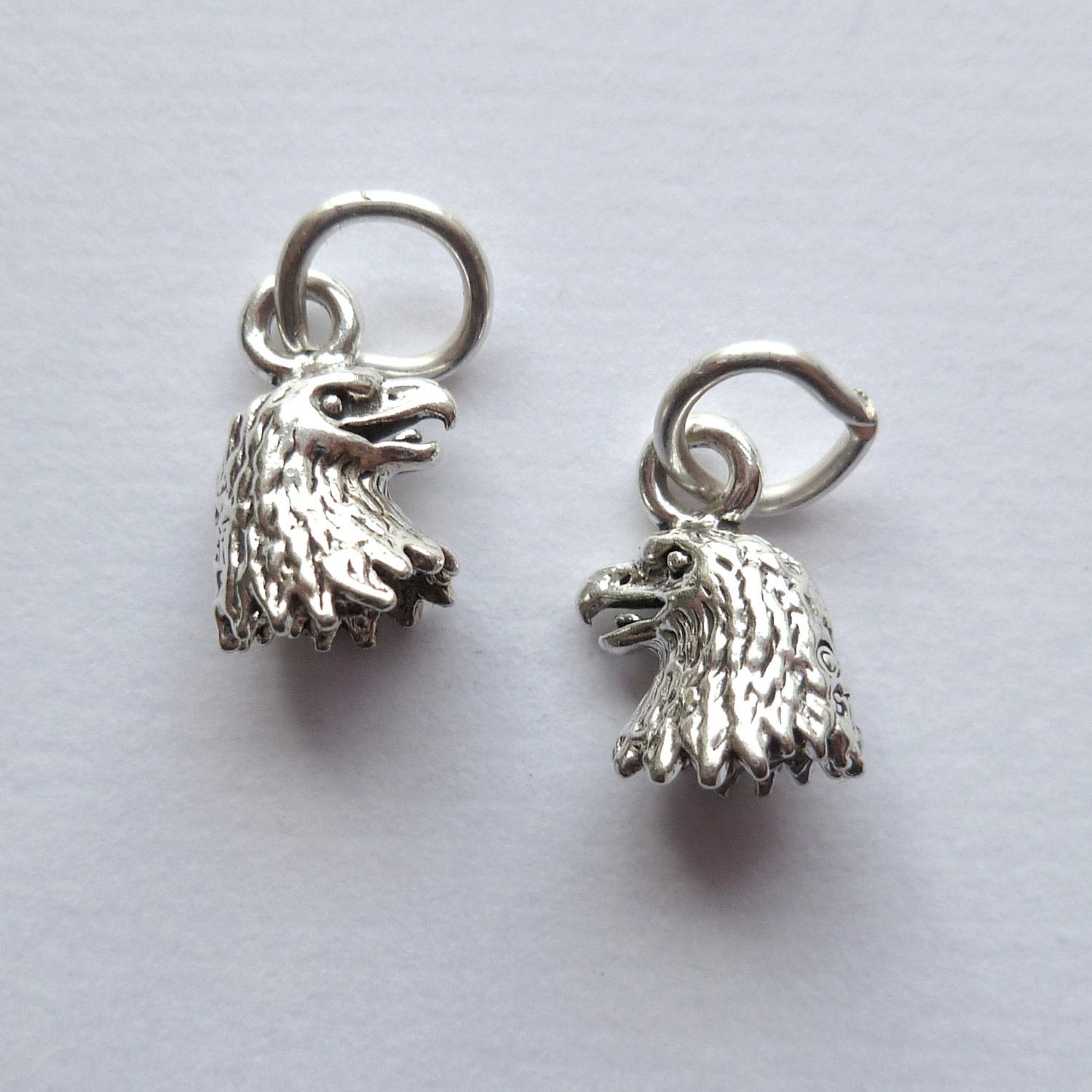 2  eagle head sterling silver charms, pendants, dangles, cast 3D design, 11x7mm, US made, with jump ring, 1 pair. (CHMSS).