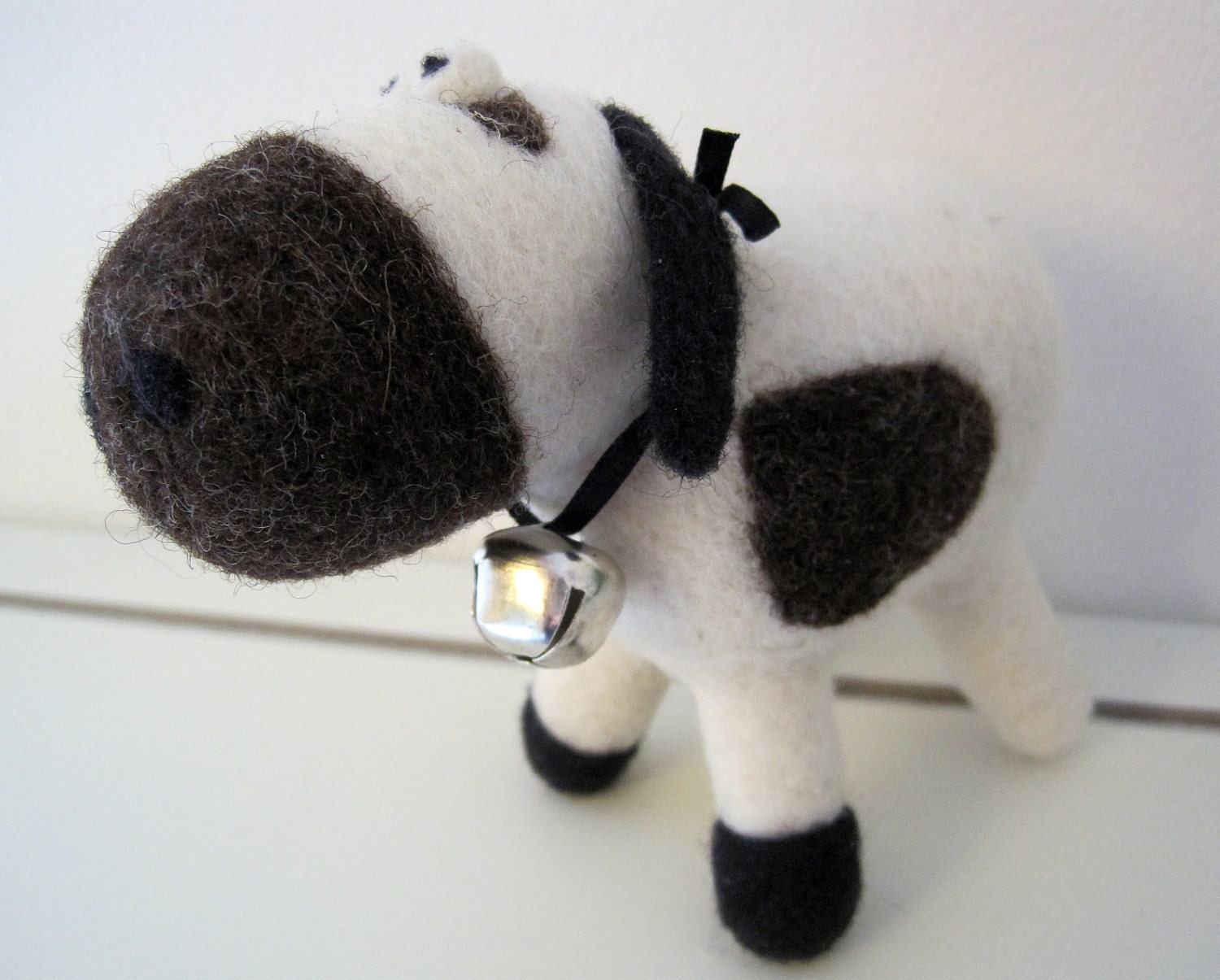 Suzie the needle felted white, black and brown cow