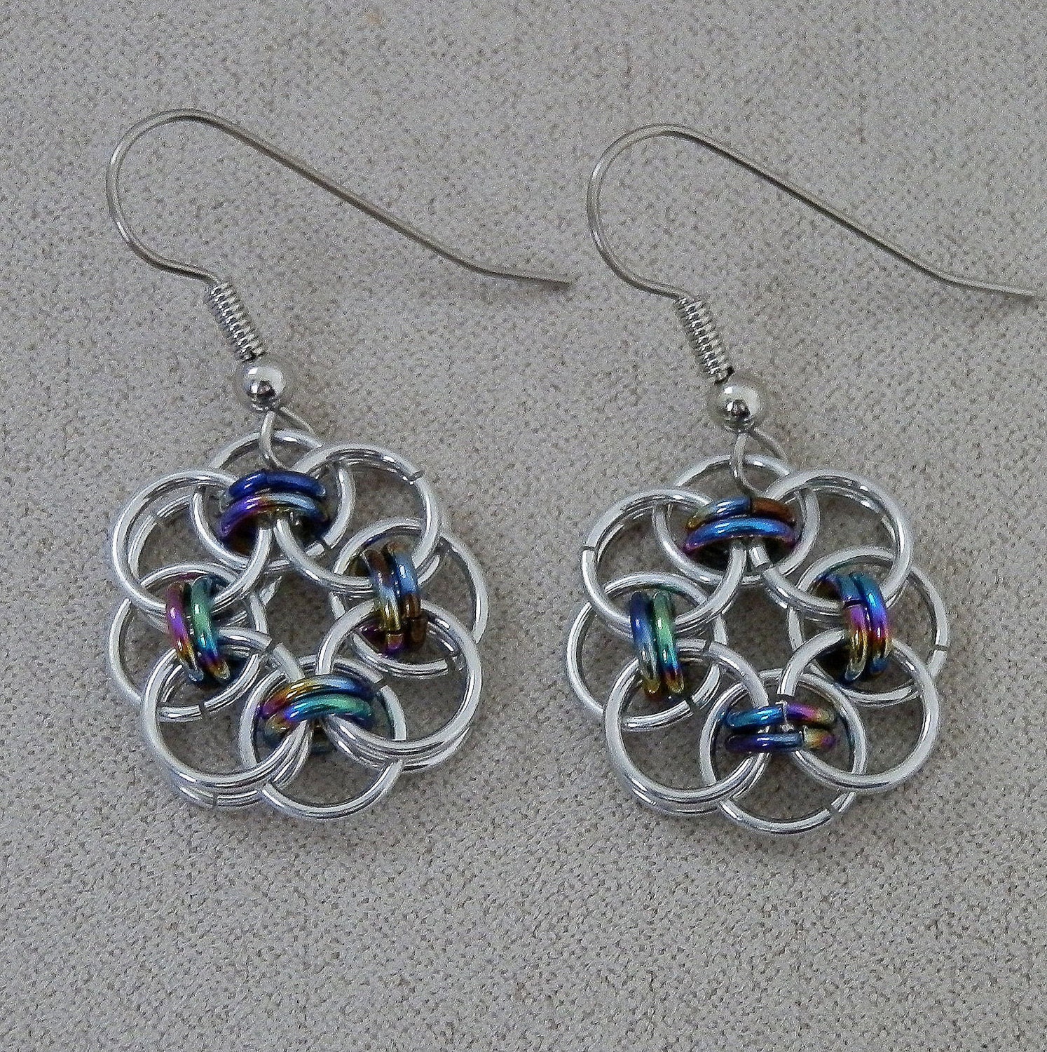 Earrings, Chainmaille, Celtic Style Helm Weave, Flower Rosette Drops in Silver and Black Rainbow Jump Rings, Handmade by Lace Metal on Etsy