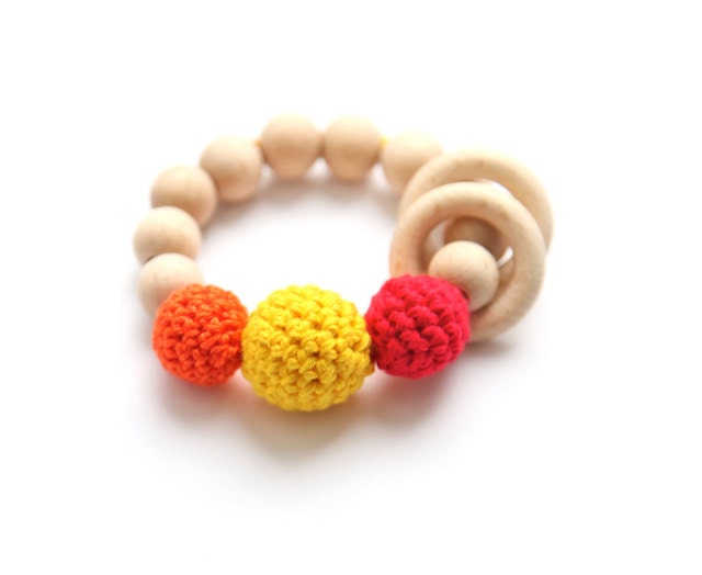 Teething toy with crochet red, orange and yellowt wooden beads and 2 wooden rings. Wooden rattle. Gift for baby and mum.