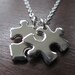Two Miniature Puzzle Piece Pendants on one Necklace