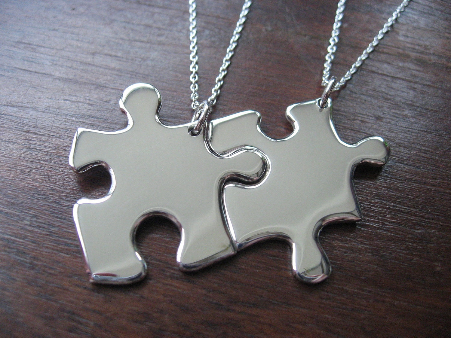 Two Silver Puzzle Piece Pendants