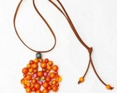 Orange wooden bead pendant, woven, grey and pink highlights, tangerine tango, minimalist, pantone fashion colours