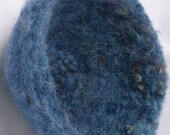 Bowl, felted, blue, with bits of gold and novelty yarns.