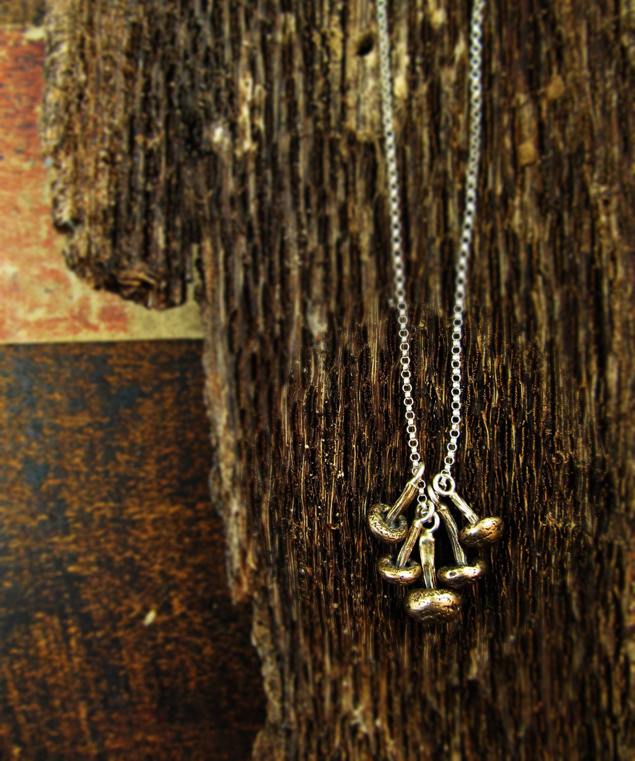 mushroom charm necklace in sterling silver and bronze