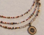 Seed Bead, Crystal, Pearl, Brass and Birdnest Charm Necklace - centerofbalance