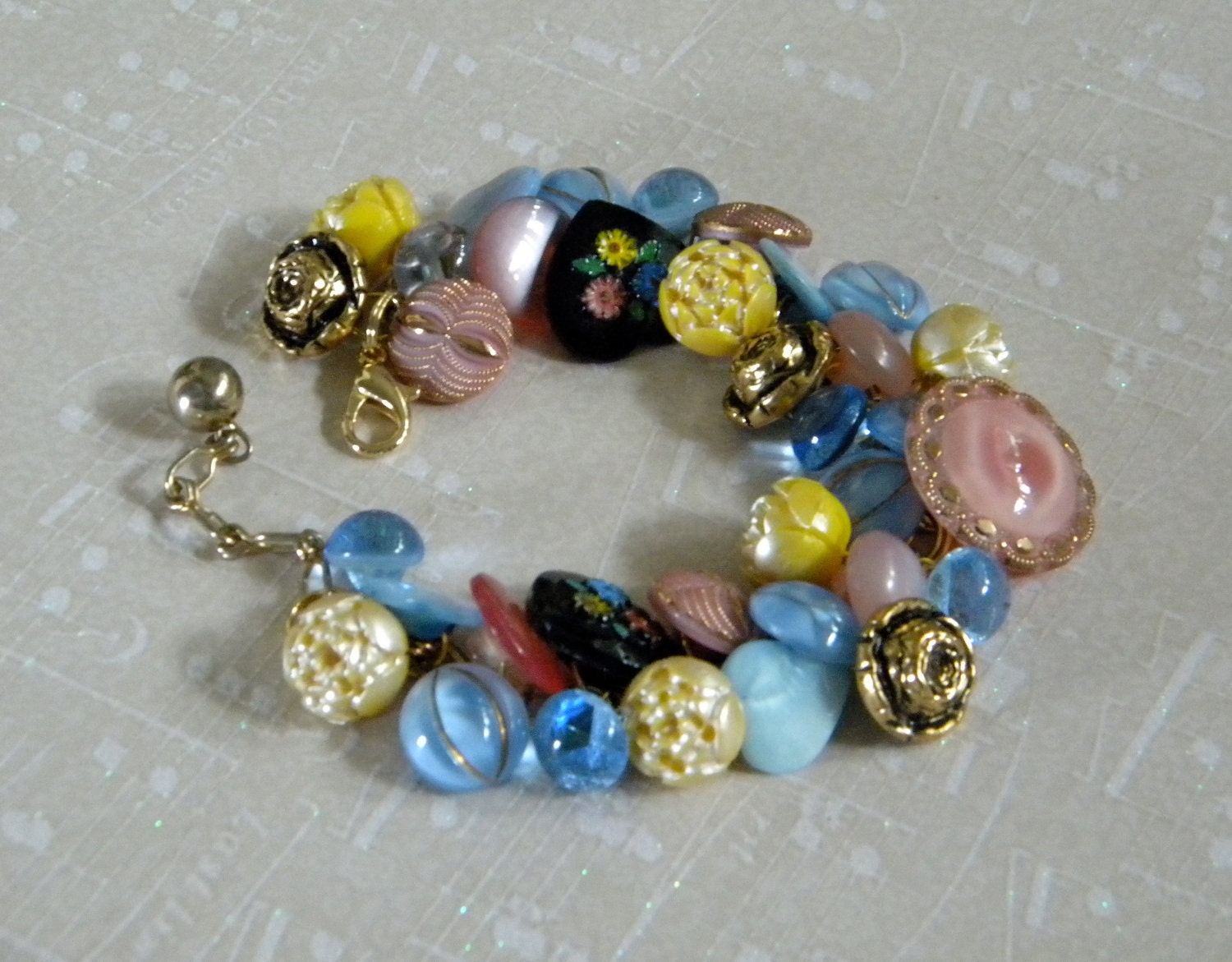 Vintage button bracelet glass, metal and plastic buttons in pink, yellow, blue and black hearts and flowers