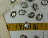 10 tiny silver tone cabochons
