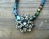 Elegant black found object hand beaded necklace