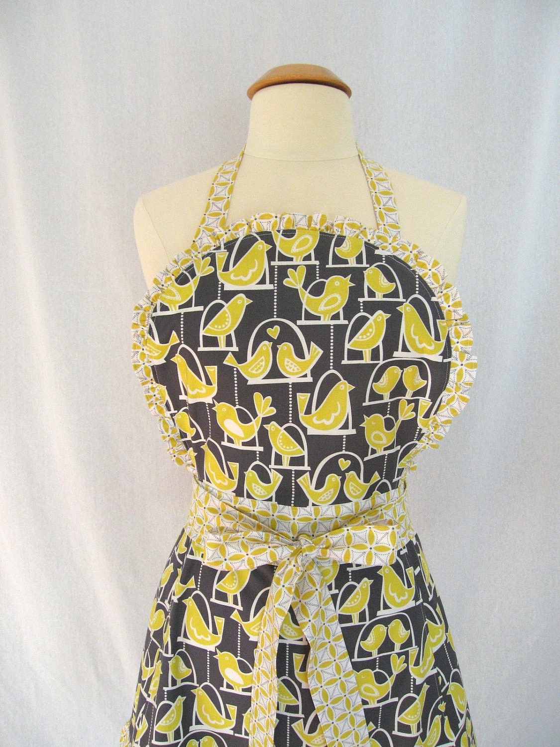 Full Apron with Ruffles and Citron Lovebirds on Birdswings on a Gray Background - Michael Miller Citron Gray Fabric