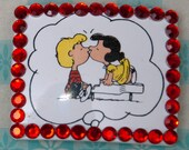 Plastic Jeweled Peanuts Hair Clips: Snoopy as Joe Cool and Schroeder & Lucy kissing