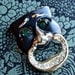Strange Laughing Mask Brooch - Emerald Eyes
