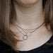 Two circles necklace: oxidized sterling silver and blue copper circles - modern jewelry