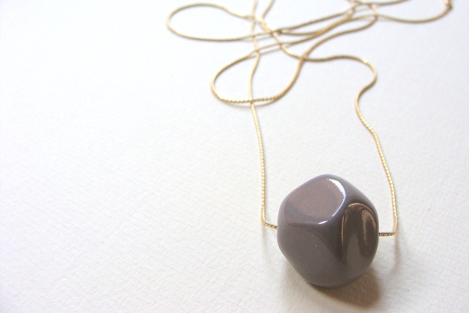 Geometric necklace.  Minimal necklace Lavender. Irregular lilac polihedral shape of resin, prism in a golden chain. Lilac grey