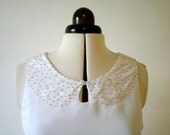 White mini dress with gold peter pan collar