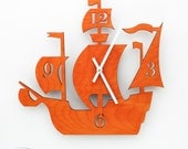 The "Dread Pirate Roberts" in Orange, a designer wall mounted clock from LeLuni