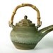 Teapot and tea bowls set with bamboo handle in olive green celedon