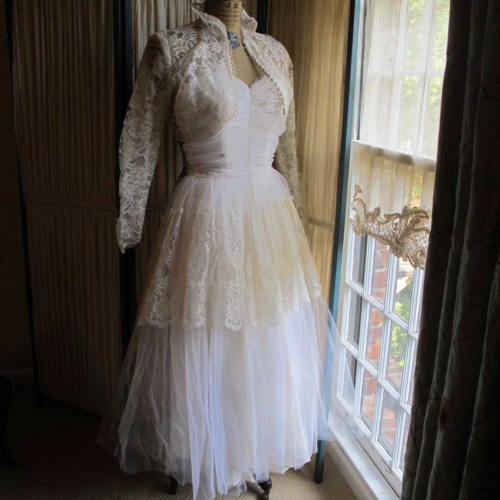 Ruched Tulle Bodice Wedding Gown with Lace Bolero Jacket and Hip Overlay