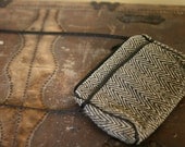 black and white herringbone patterned purse