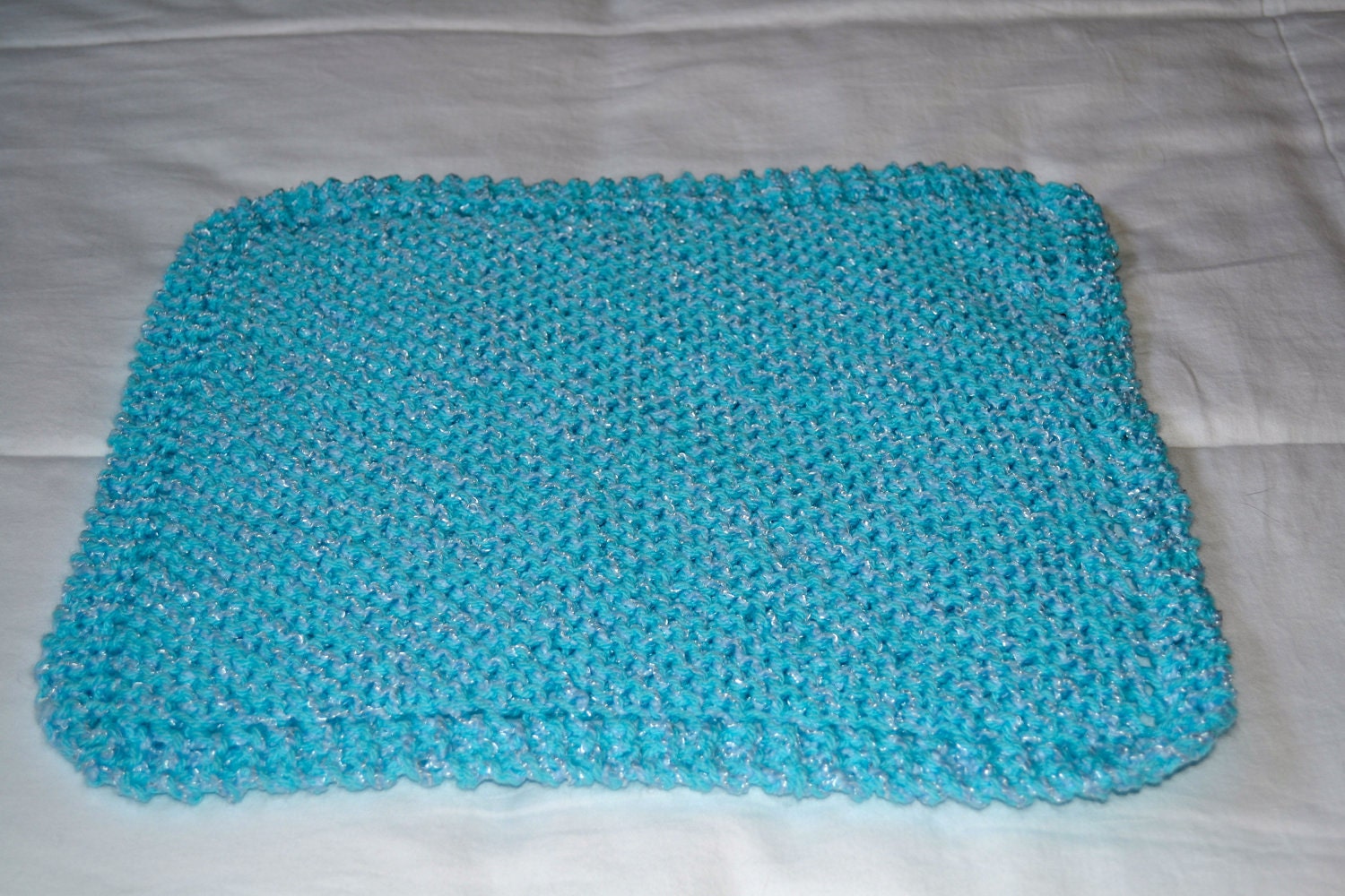 Hand knit baby doll blanket, available in different colors