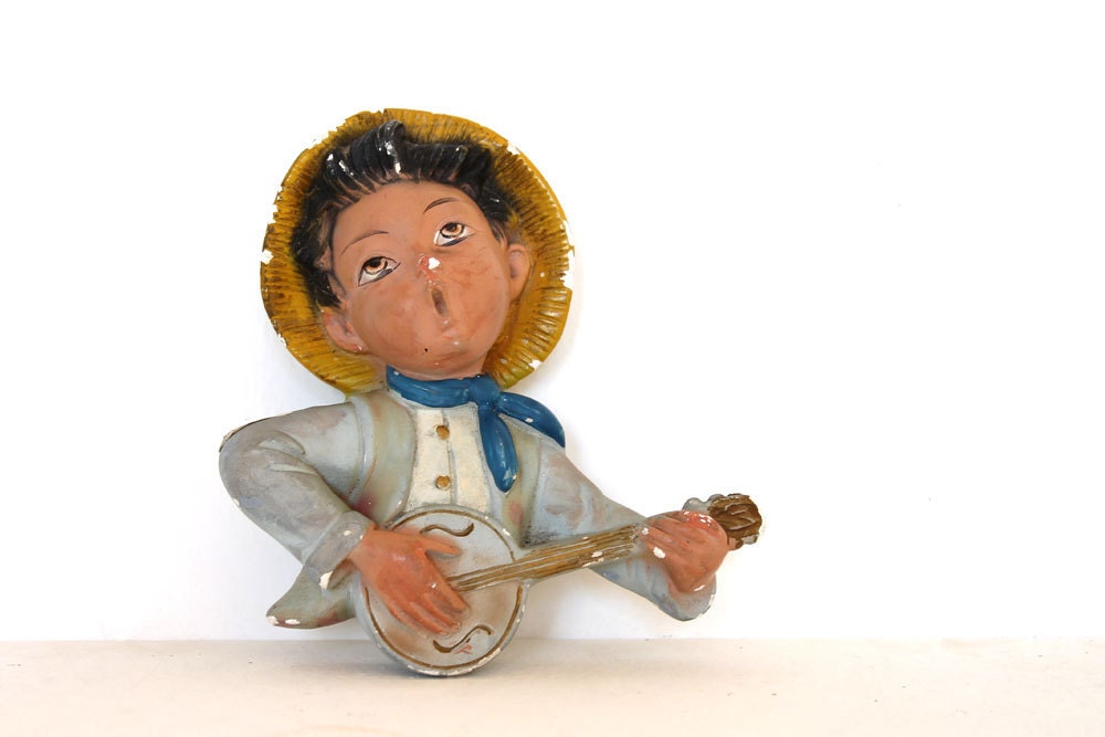 Vintage chalk guitar player