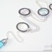 Silver chain lariat necklace with round silver disks and blue & frosted glass bead detailing. OOAK