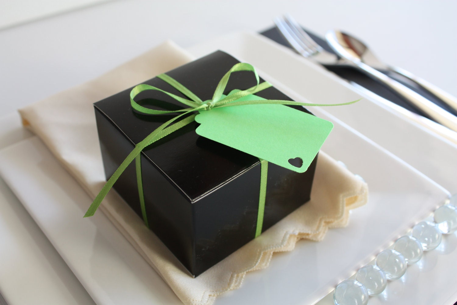 Black High Gloss Tuck Top Favor Box - favor box with ribbon and tag.