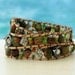 Edelweiss... Leather wrap bracelet... typical Bavarian triple wrap bracelet. Original OceanBead style.