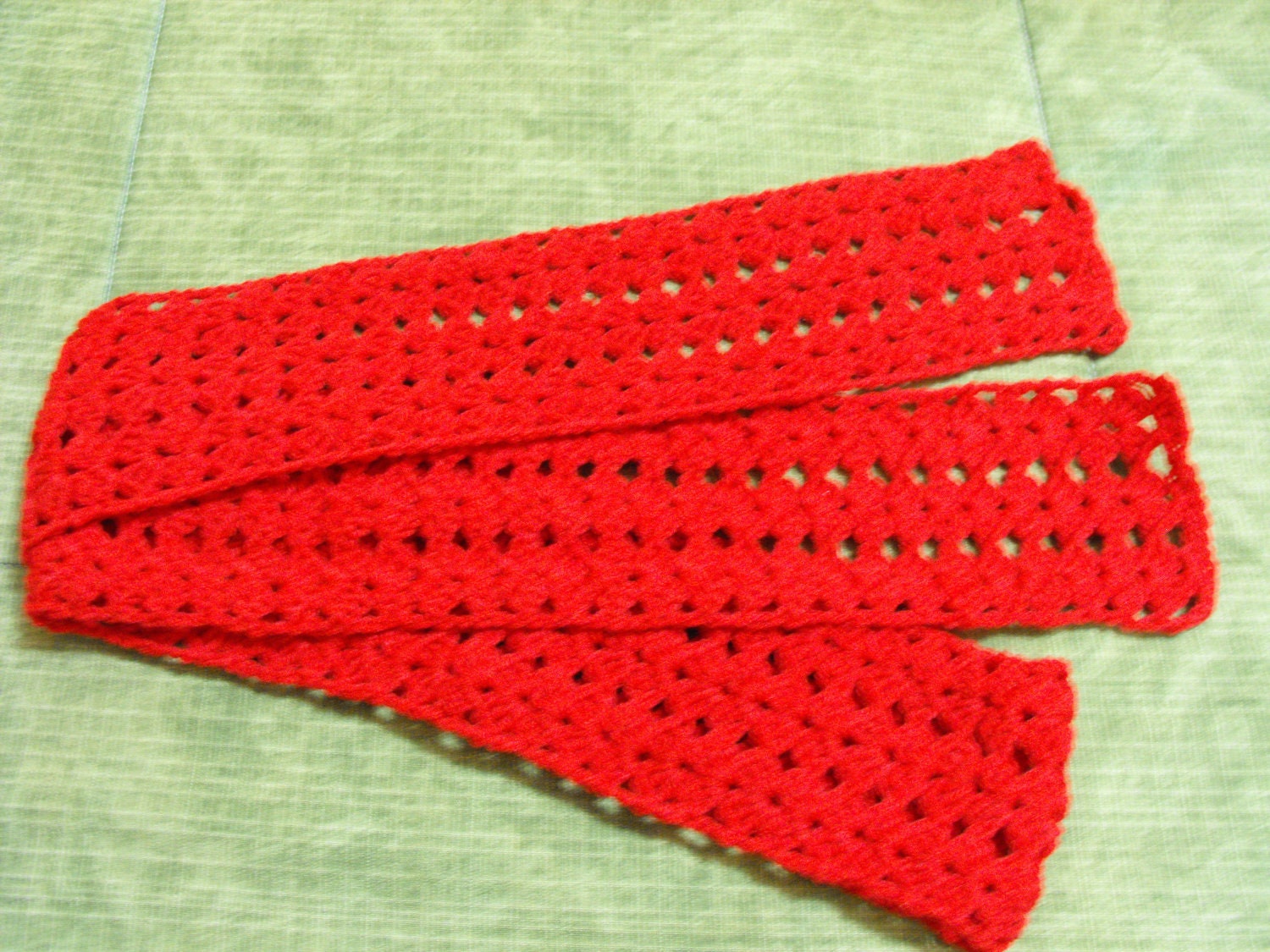 Handmade crochet lacy effect scarf.