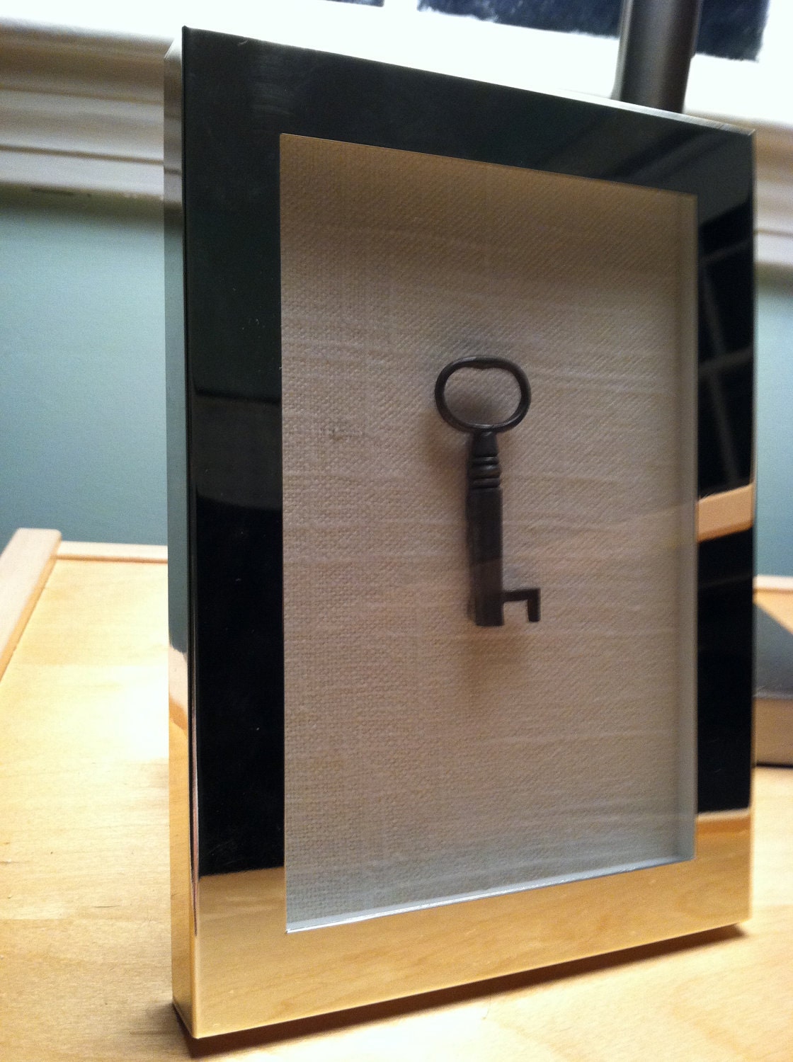 antique skeleton key in chrome frame