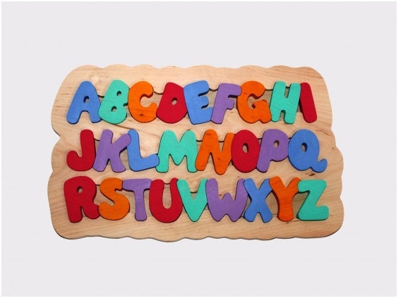 Hand made wooden puzzle with English alphabet