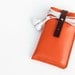 Hand Stitched Leather iPhone case with wristlet strap in orange