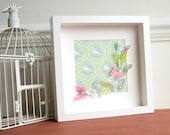 Pink and green fluttering butterflies in white box frame