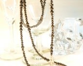 Hematite with Crystal Skull Extra Long Rosary Style Necklace