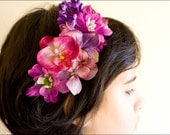A purple and plum flower headpiece