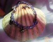 Czech crystal and silver ocean charm bracelet.