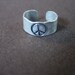 Ear Cuff, Hand Hammered Aluminum with a PEACE sign stamped into the metal and blackened