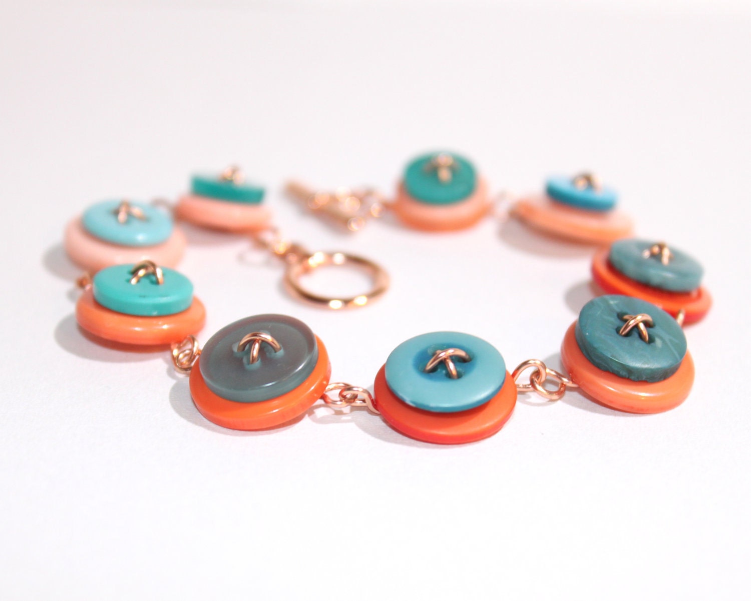 Orange and teal button bracelet - d2kgalleries