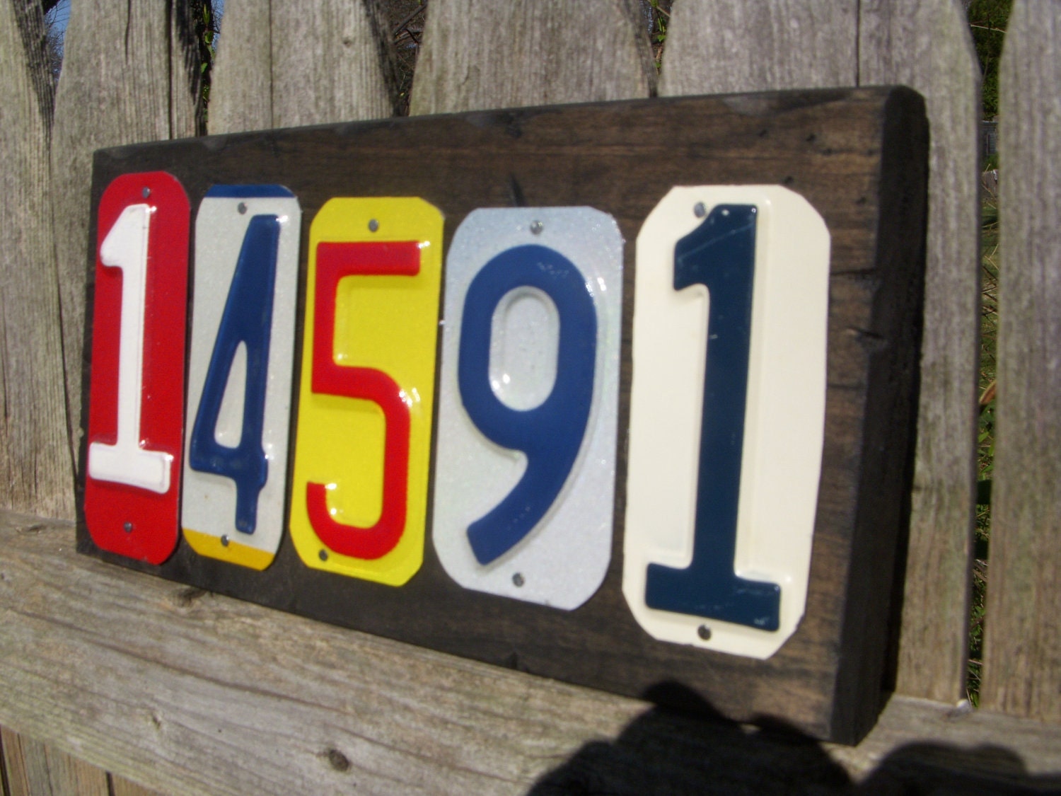 Custom made 5 number address sign made with recycled license plates.