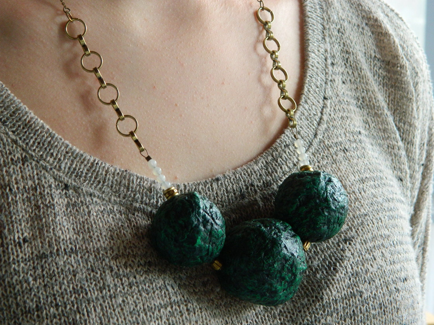 The Metamorphic Orb necklace - glossy black and green
