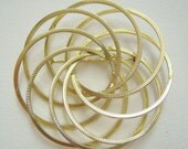Large multi-circle gold toned brooch