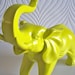 Ollie the fun glossy yellow elephant