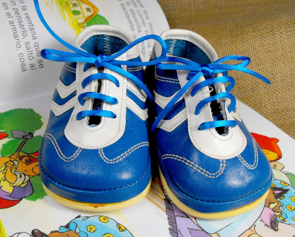 Cute baby shoes in blue and white. Adorable leather sneakers
