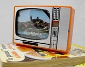 Retro plastic TV with slides of Spain. Vintage televisor from 70s 80s. Salamanca city